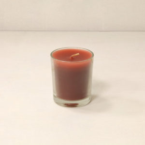 candela jess in contenitore di vetro